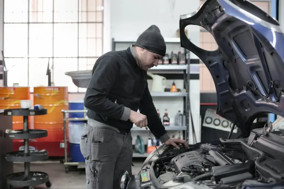 Expert mechanic working on a car engine