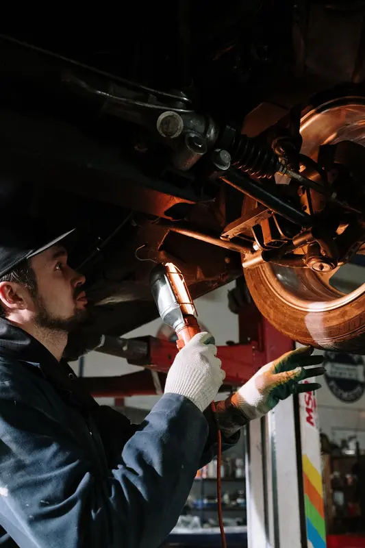 Car wheel and tire being serviced